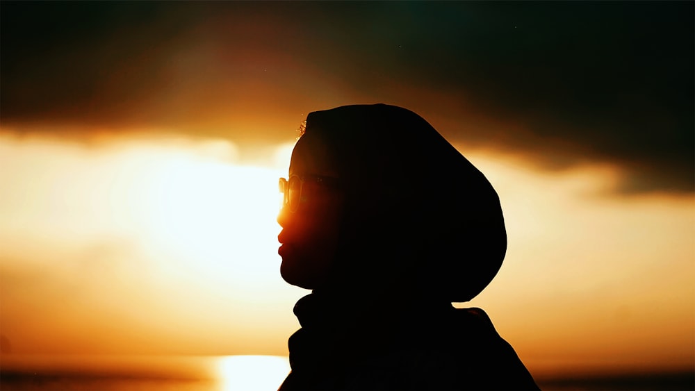 silhouette of man during sunset