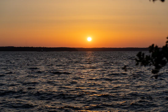 A serene sunset over a vast horizon symbolizing the concept of endings and new beginnings.