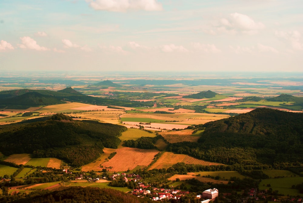 aerial view of green and brown field during daytime