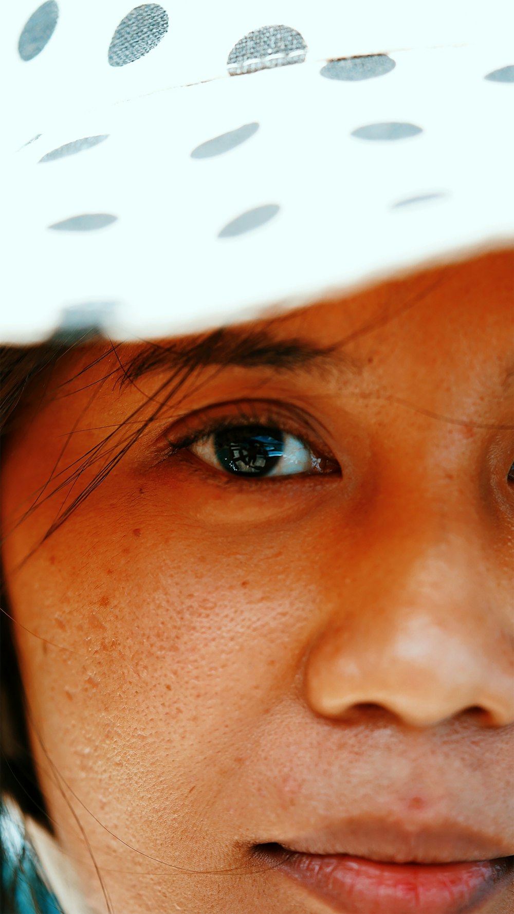 woman with blue eyes and brown hair