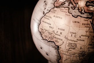 white and brown desk globe