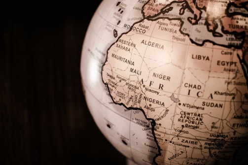 white and brown desk globe