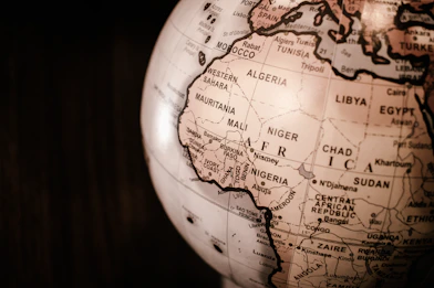 white and brown desk globe