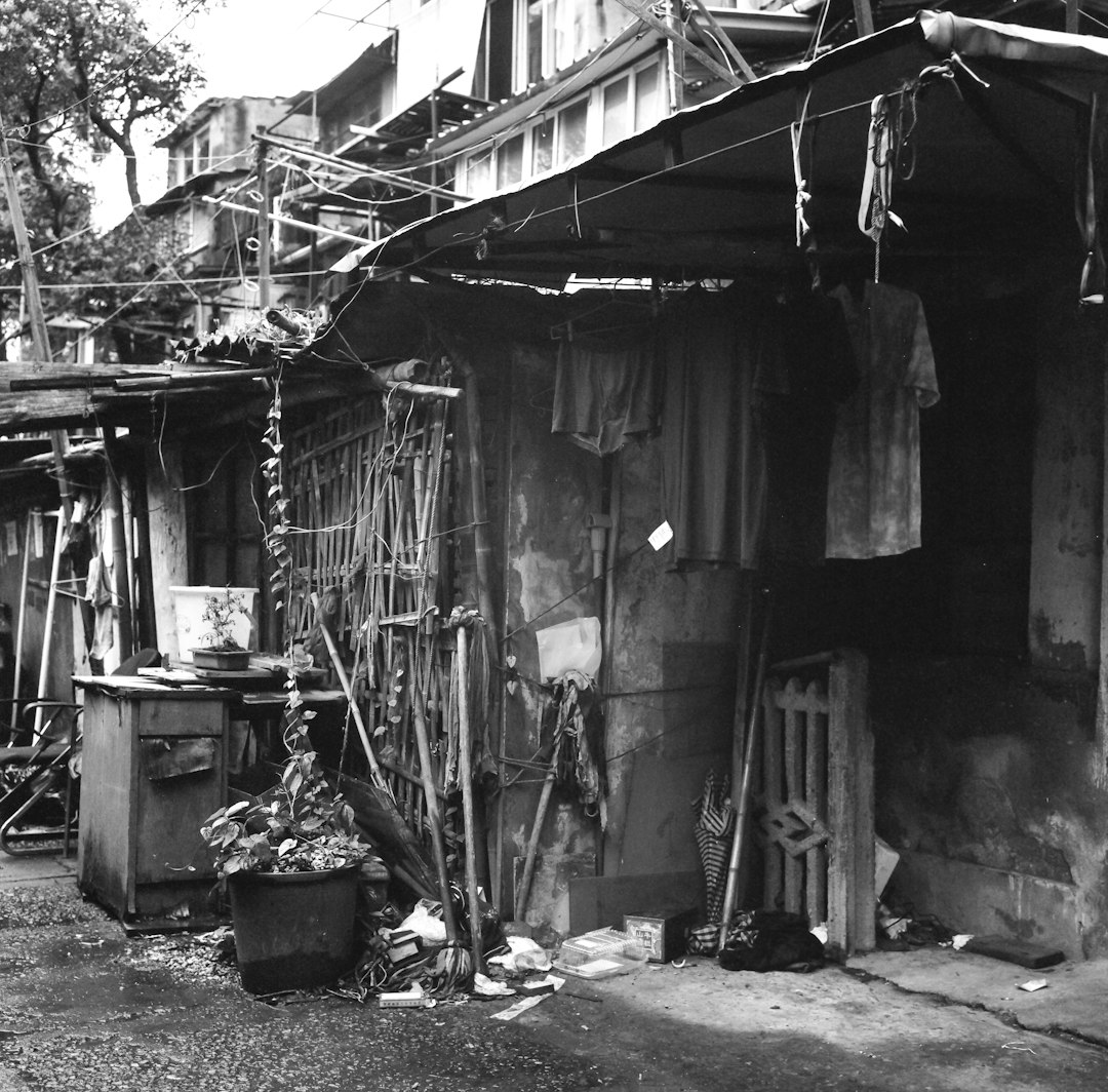 grayscale photo of wooden house