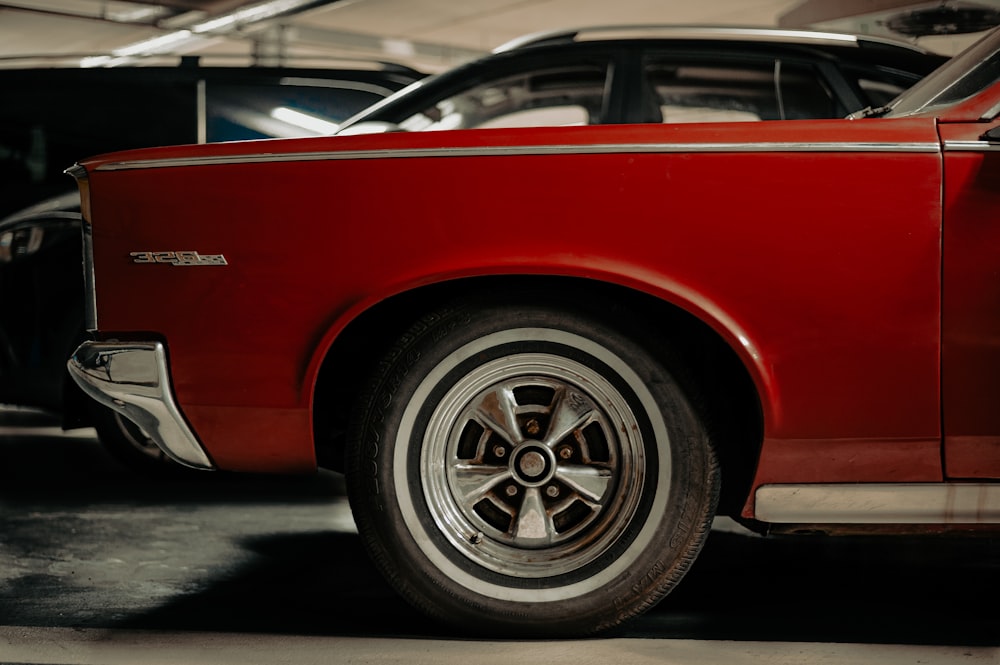 red and silver car on parking lot during daytime