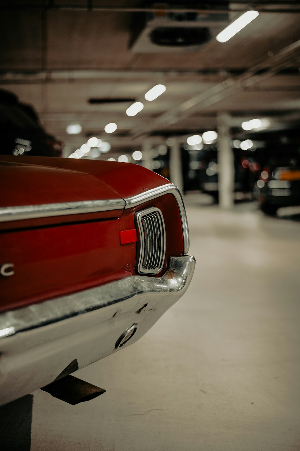 red and silver car in a parking lot