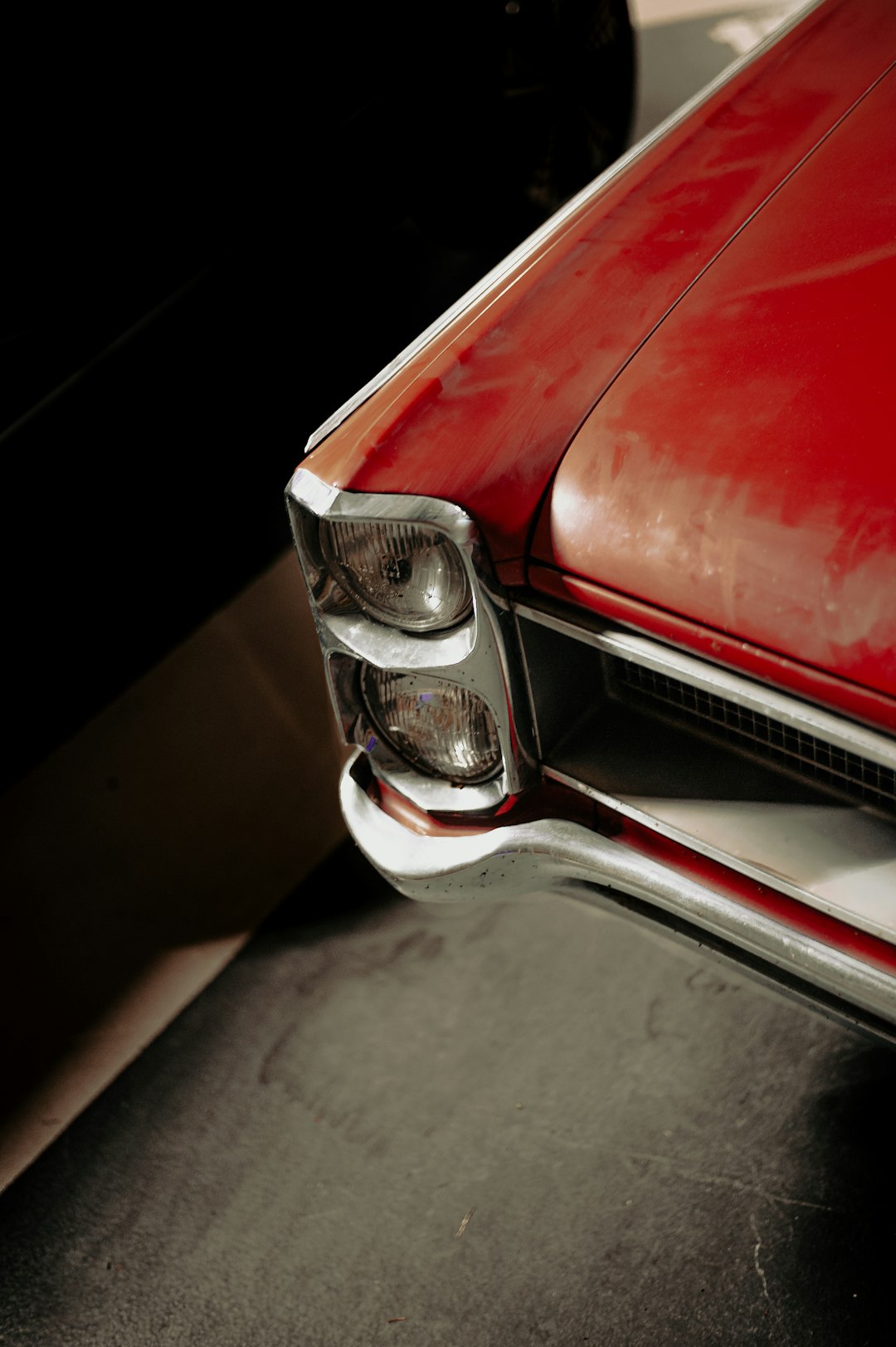 red car with silver headlight