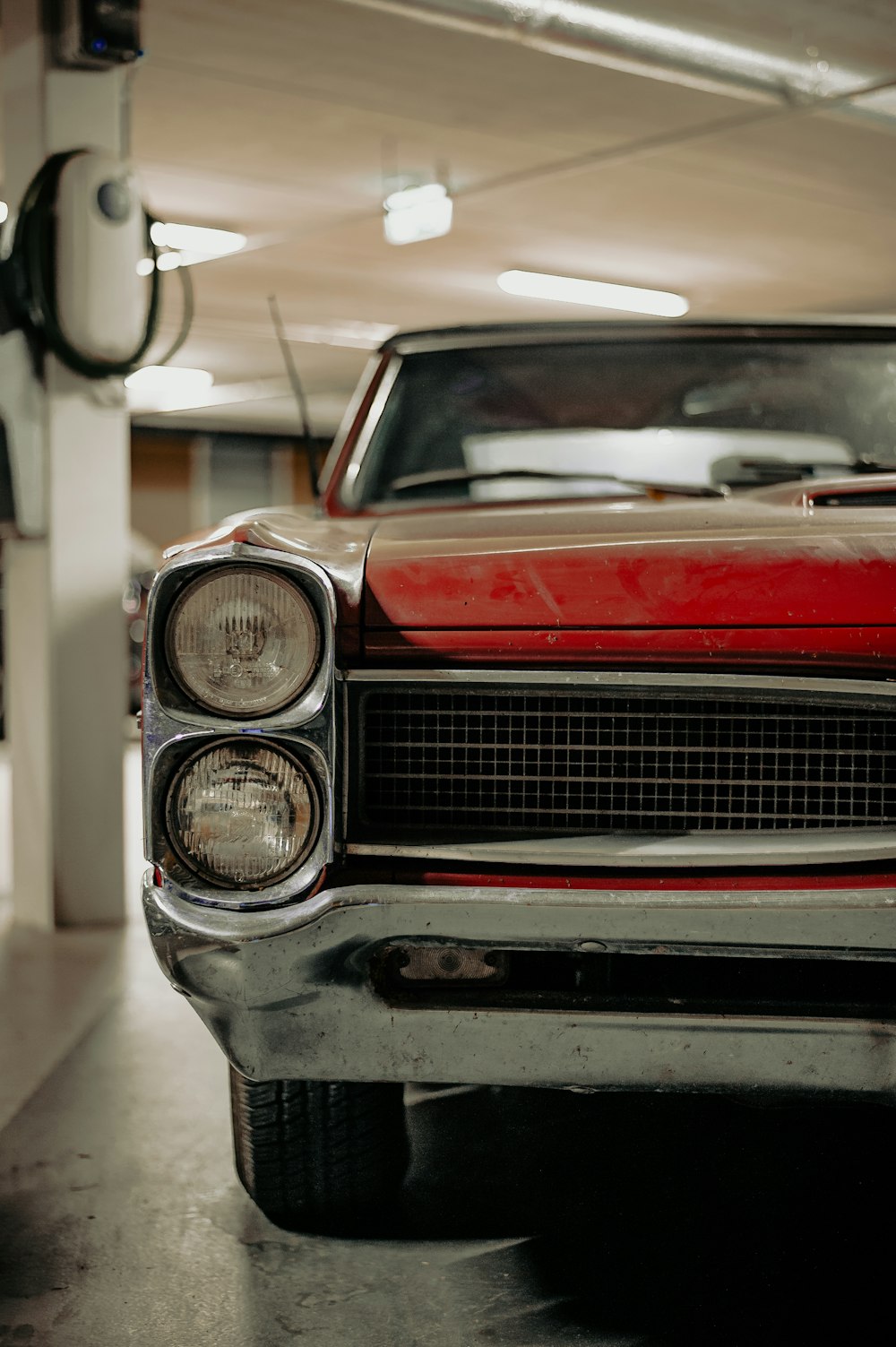 red and silver car in a garage