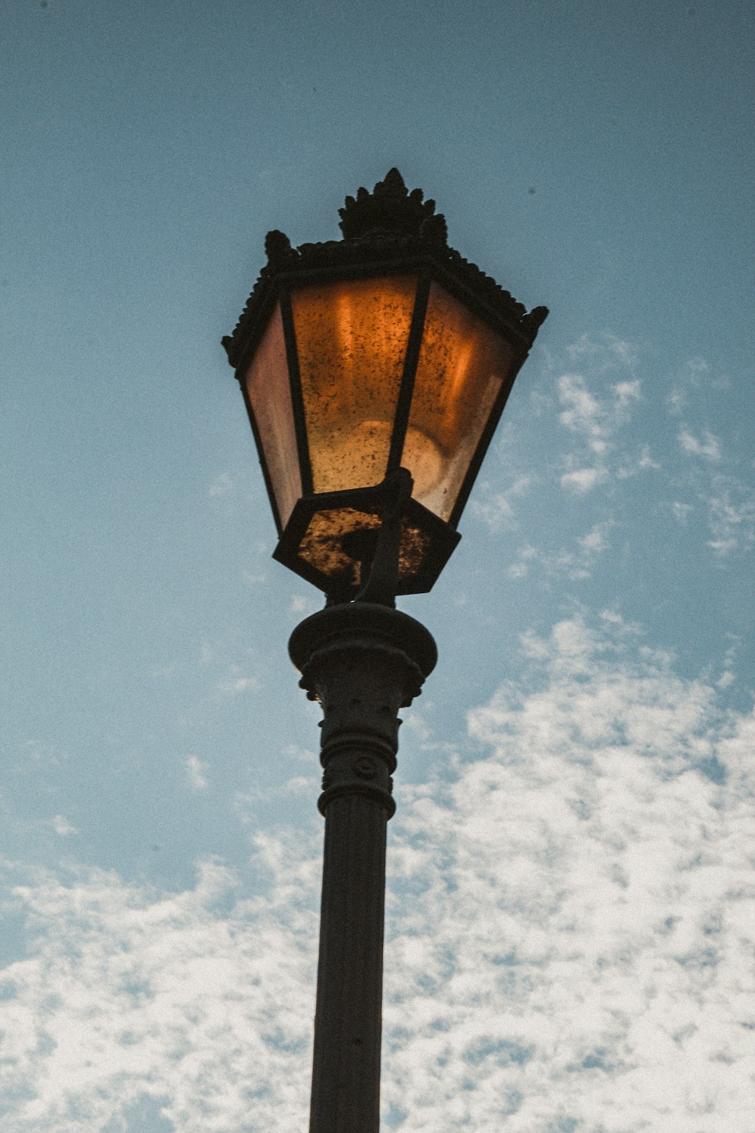 black street lamp under blue sky during daytime