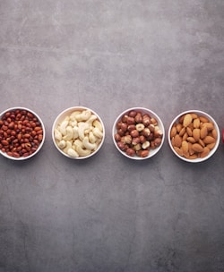 brown nuts on white ceramic bowls-topic-How Much Proteins Do You Need