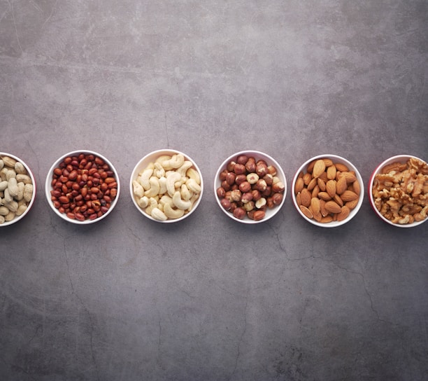 brown nuts on white ceramic bowls