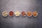 brown nuts on white ceramic bowls-topic-How Much Proteins Do You Need