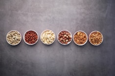 nuts on ceramic bowls-topic-How Much Protein Per Day for Lean
