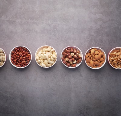 brown nuts on white ceramic bowls