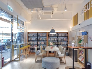 A cozy corner in a bar transformed into a quiet workspace with modern minimalistic decor