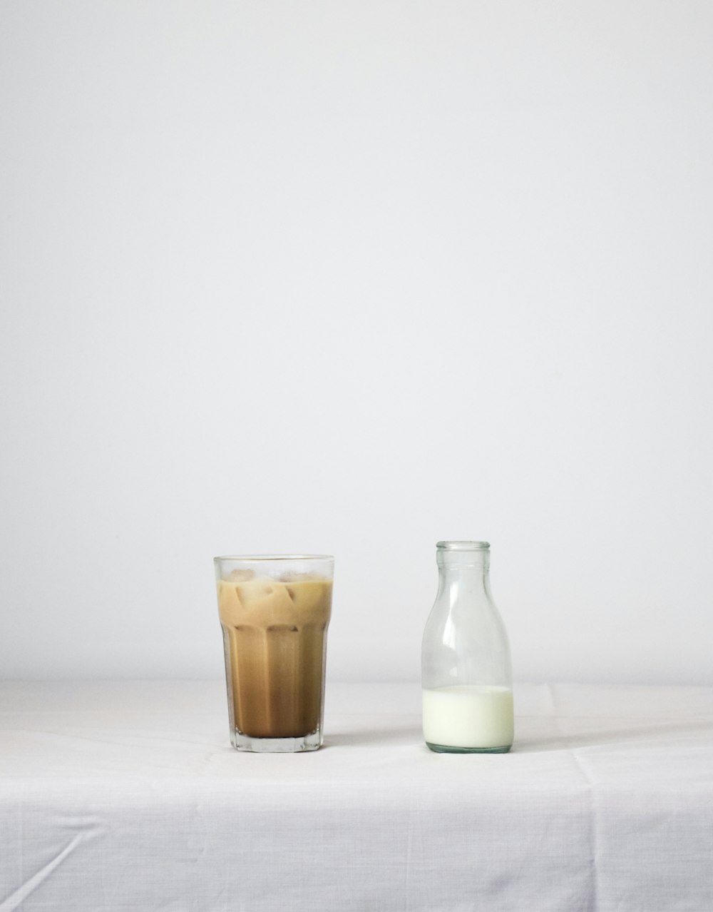 clear glass bottle beside clear glass bottle