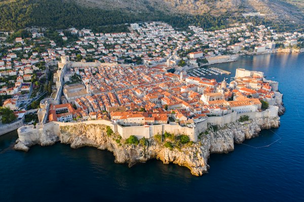 Aerial view of city buildings near body of water during daytime — Dubrovnik, Croatia
