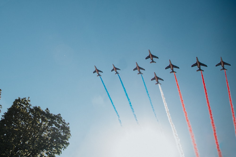 four fighter planes in mid air during daytime