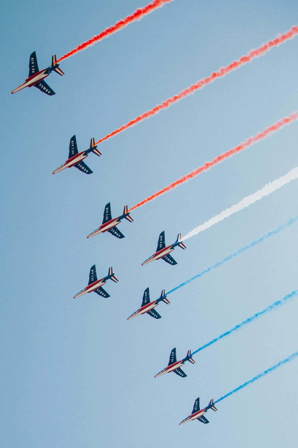 red and black fighter plane in the sky