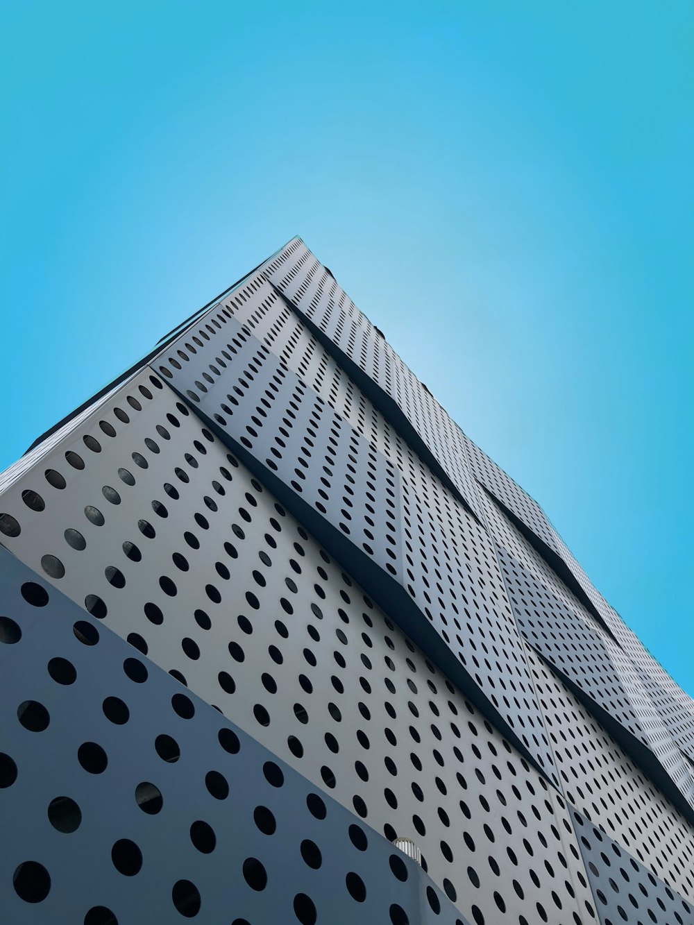 white concrete building under blue sky during daytime