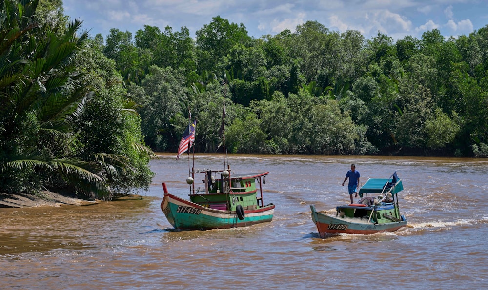 people riding on green boat on body of water during daytime