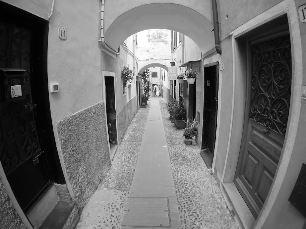 grayscale photo of hallway with no people