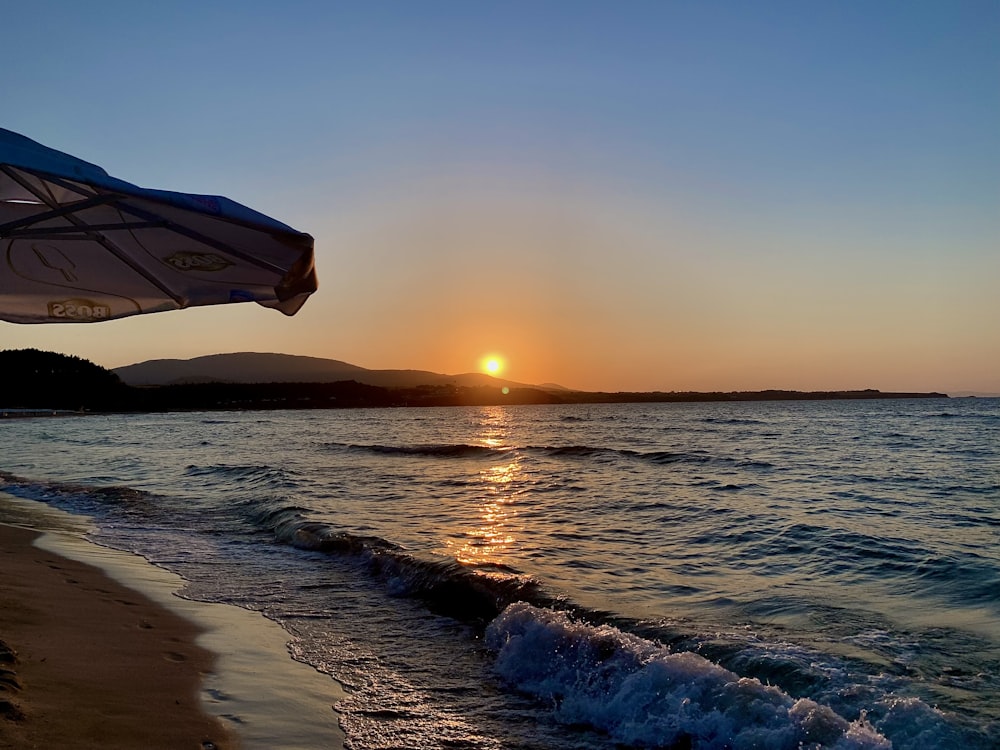 body of water during sunset