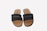 A happy customer wearing sustainable sandals from ali.