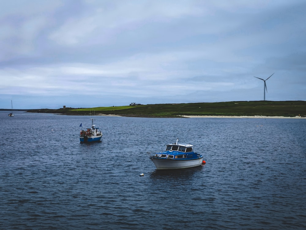 white and black boat on sea during daytime