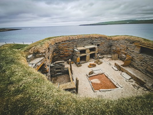 A house at Skara Brae, the Neolithic village by the Bay of Skaill — Orkney, United Kingdom