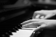 Close-up of the pianist’s hands gracefully dancing over the keys during a lively bebop tune.