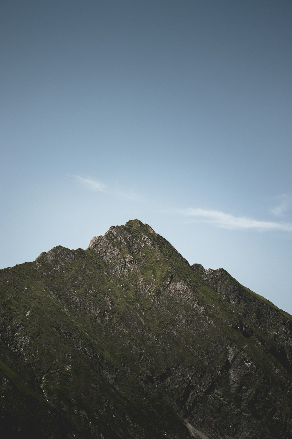 green and brown mountain under blue sky during daytime