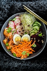 vegetable salad on black ceramic bowl