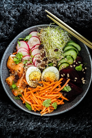 vegetable salad on black ceramic bowl