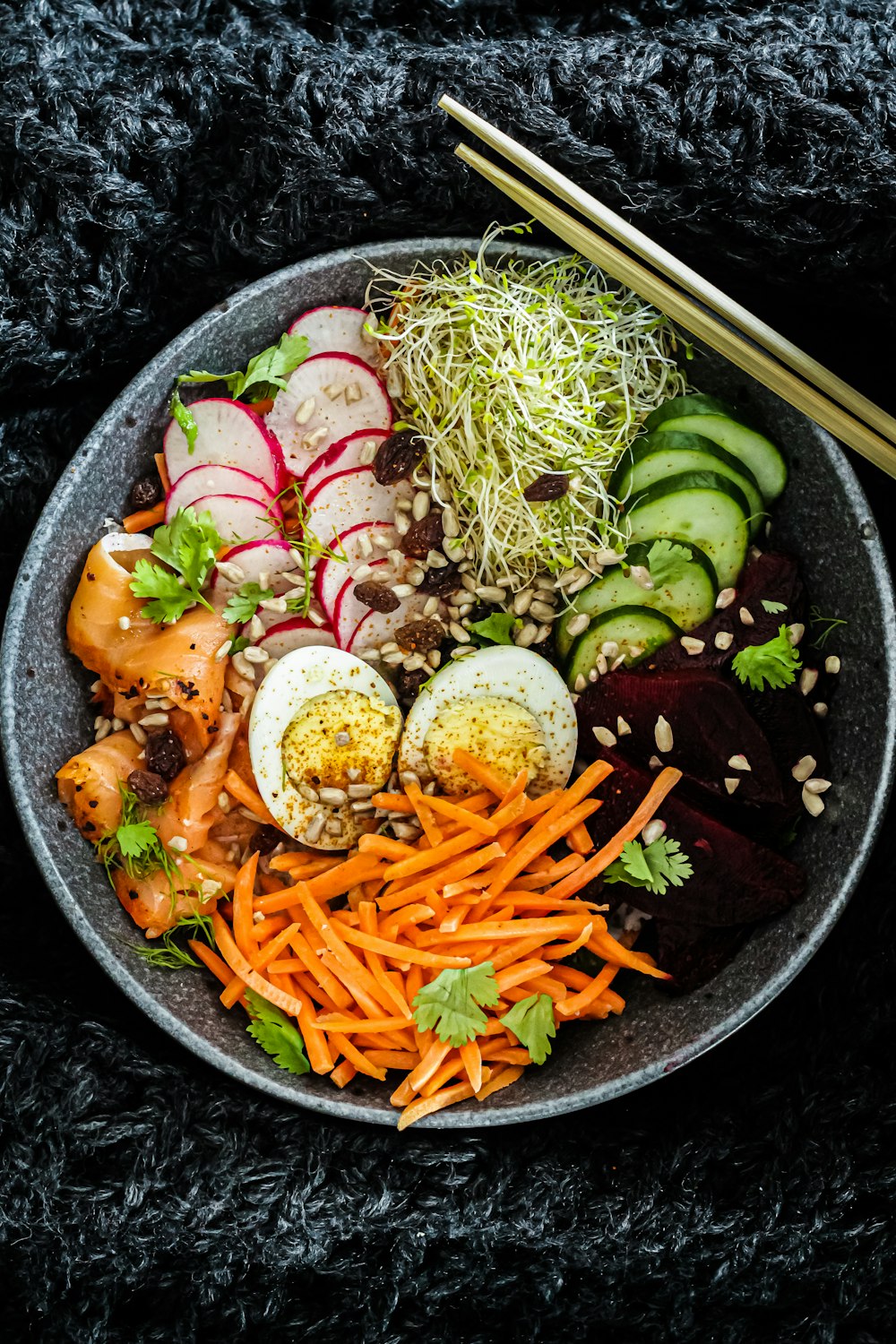 vegetable salad on black ceramic bowl
