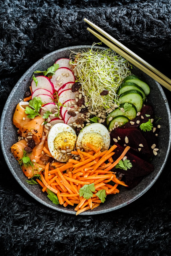 Vegetable salad on black ceramic bowl
