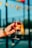 person holding clear wine glass with red wine