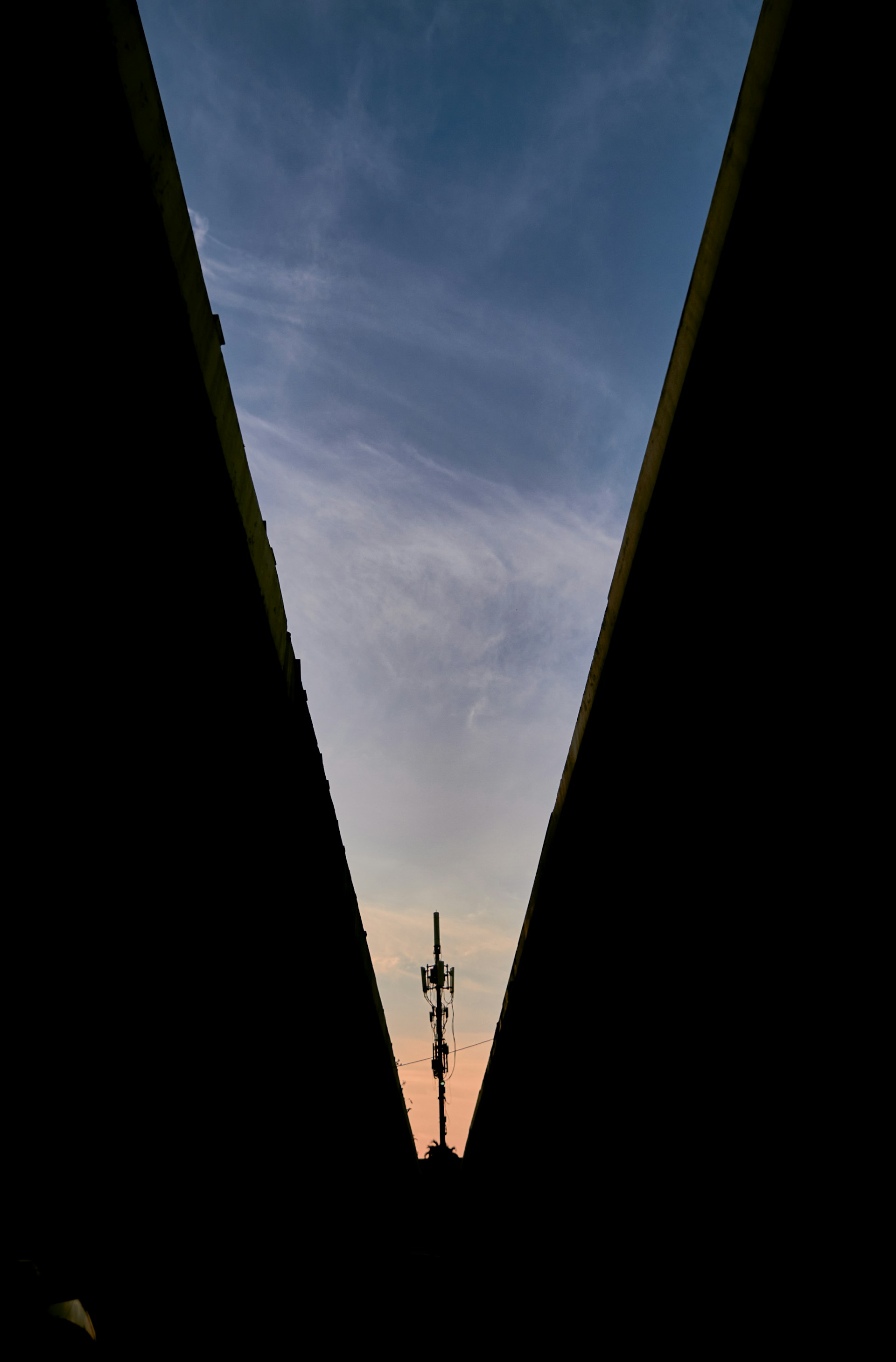 woman wearing yellow long-sleeved dress under white clouds and blue sky during daytime