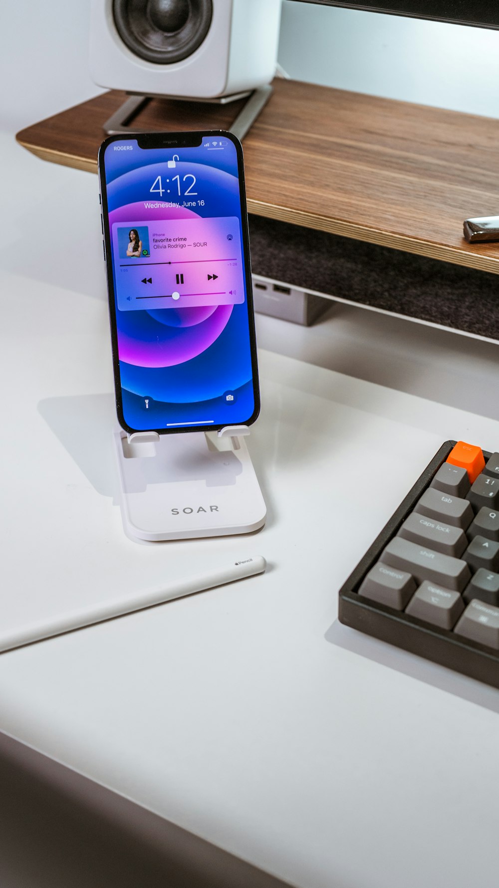 white and black smartphone on white table