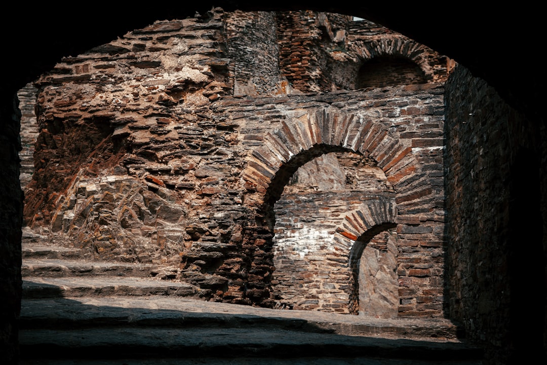 brown brick tunnel during daytime