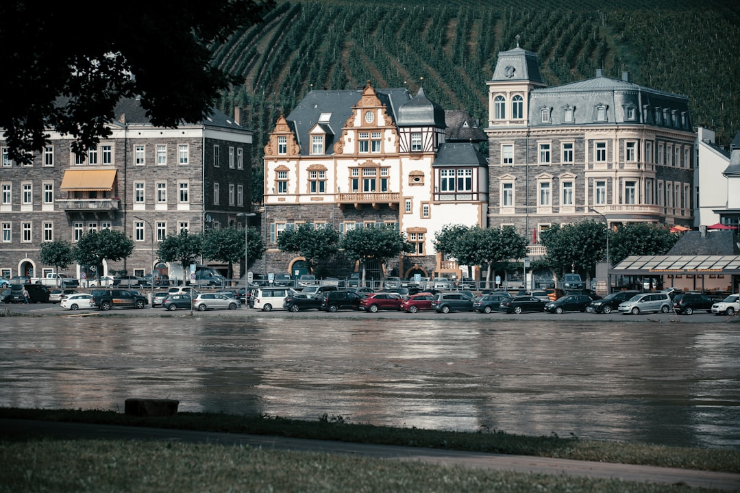 cars parked near white building during daytime