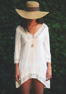 Model wearing a lace choker with a soft cream dress, standing in front of Piazza della Signoria.