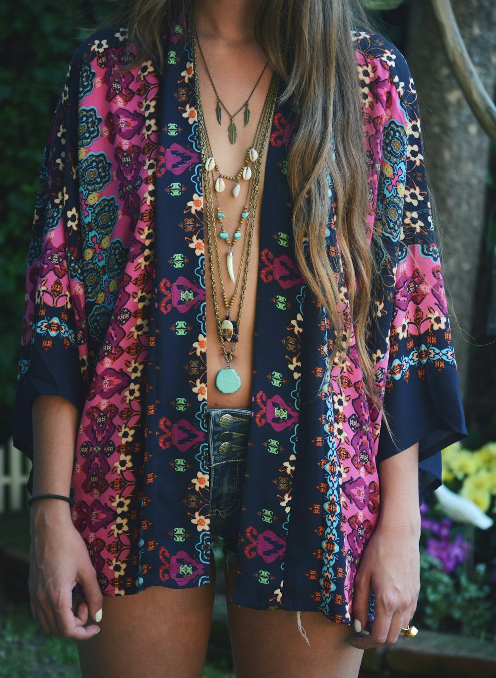 woman in blue and red floral dress