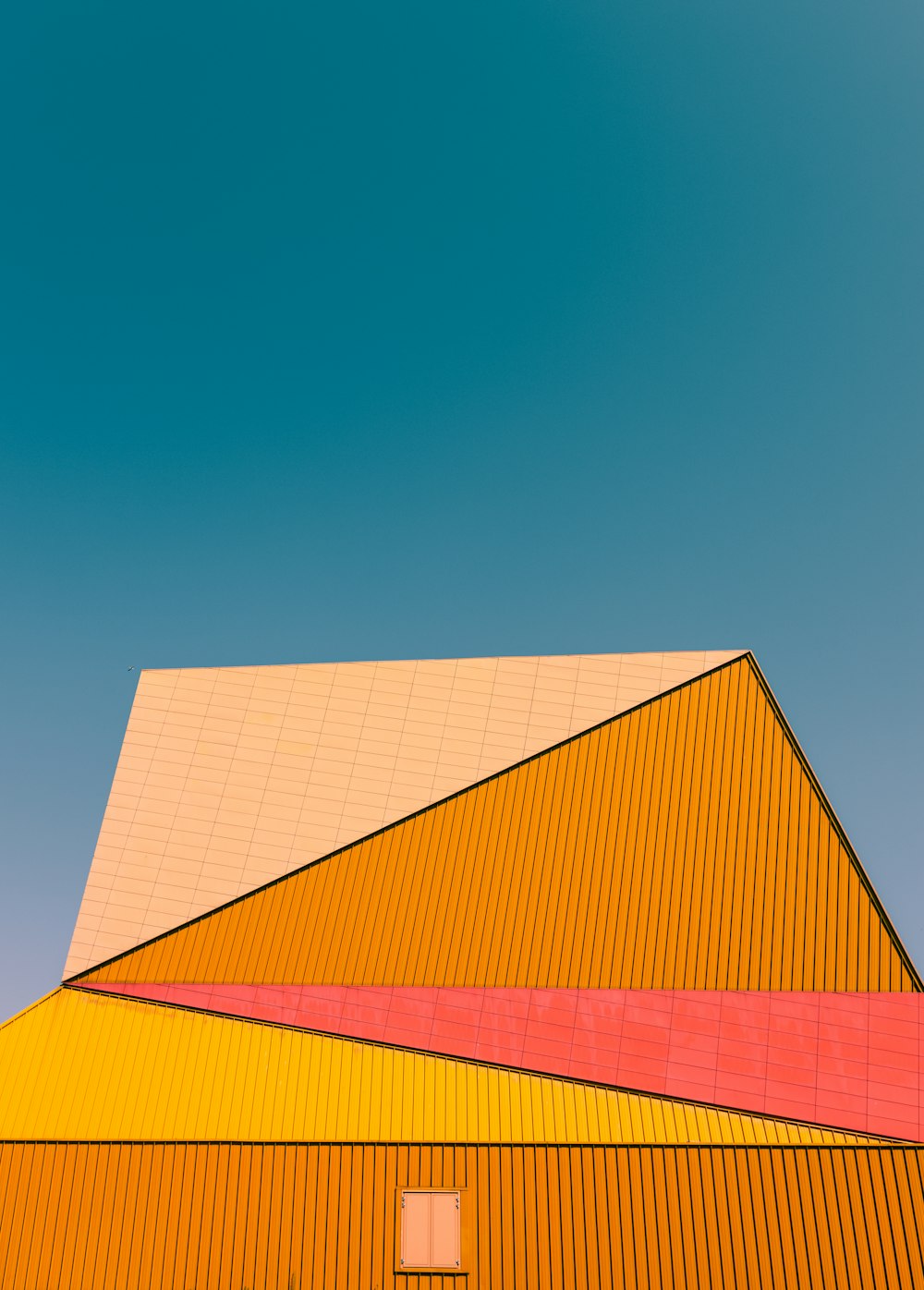 red and blue building under blue sky