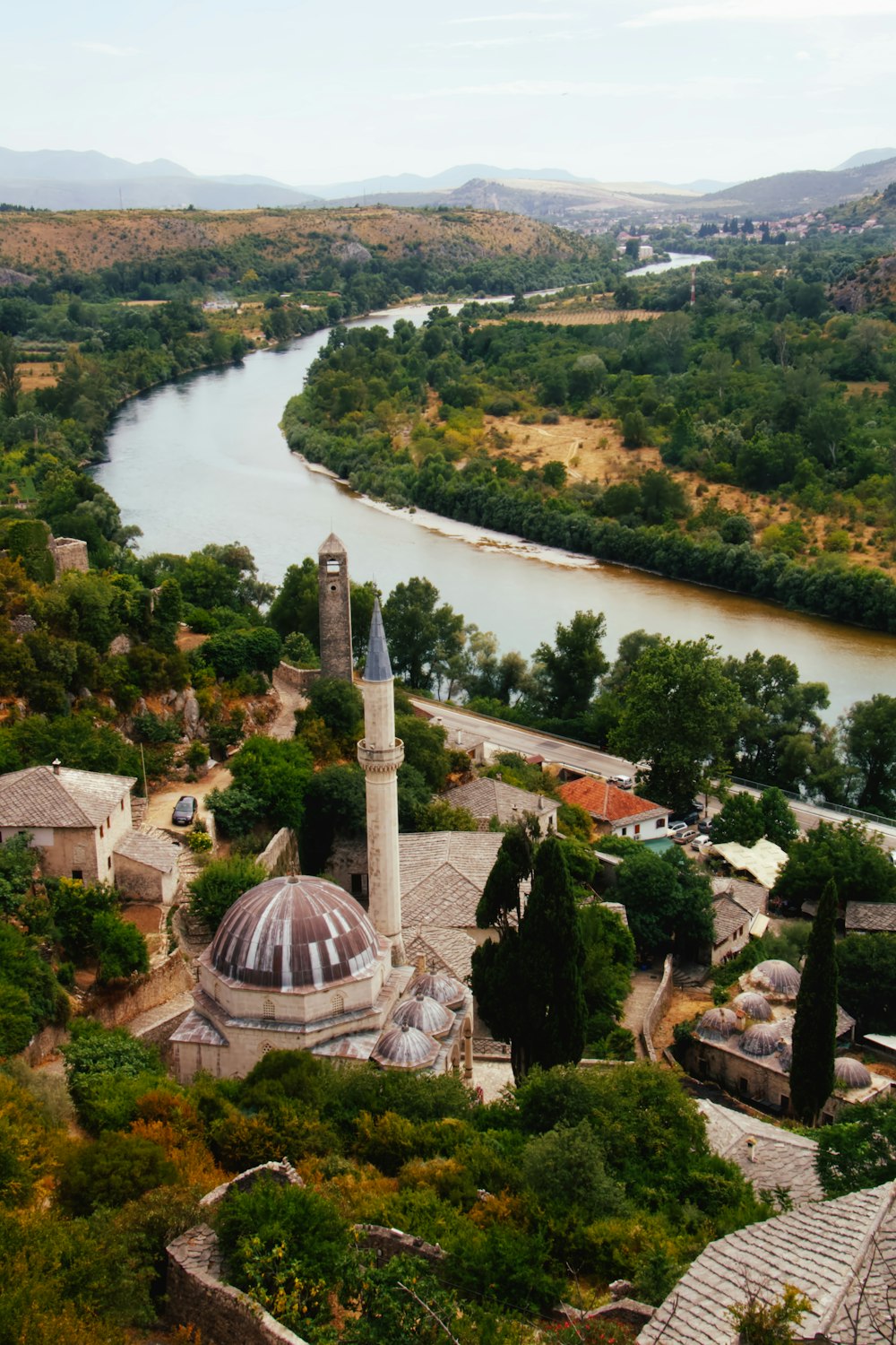 aerial view of green trees and brown buildings during daytime