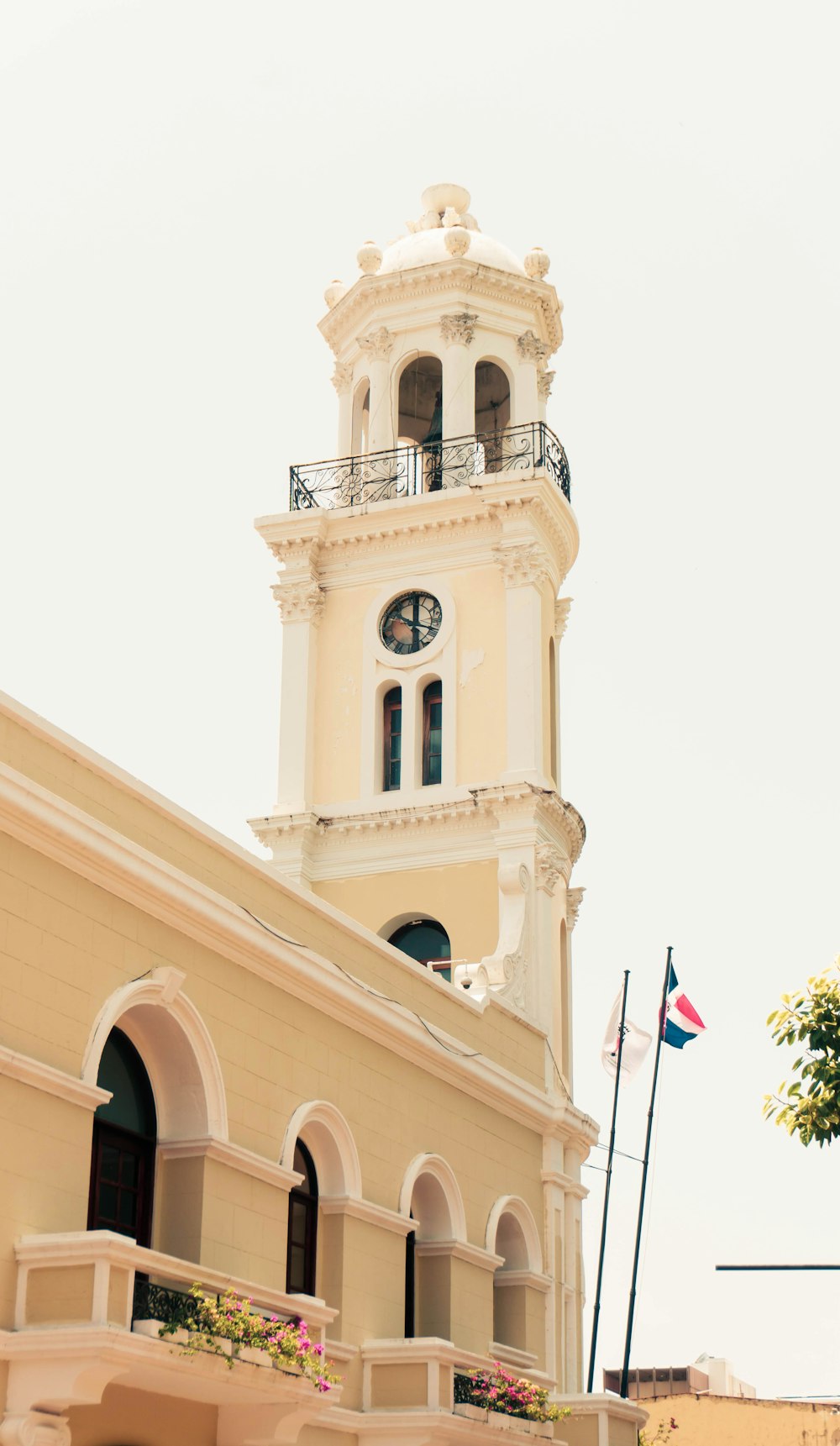 white concrete building with flag of us a during daytime