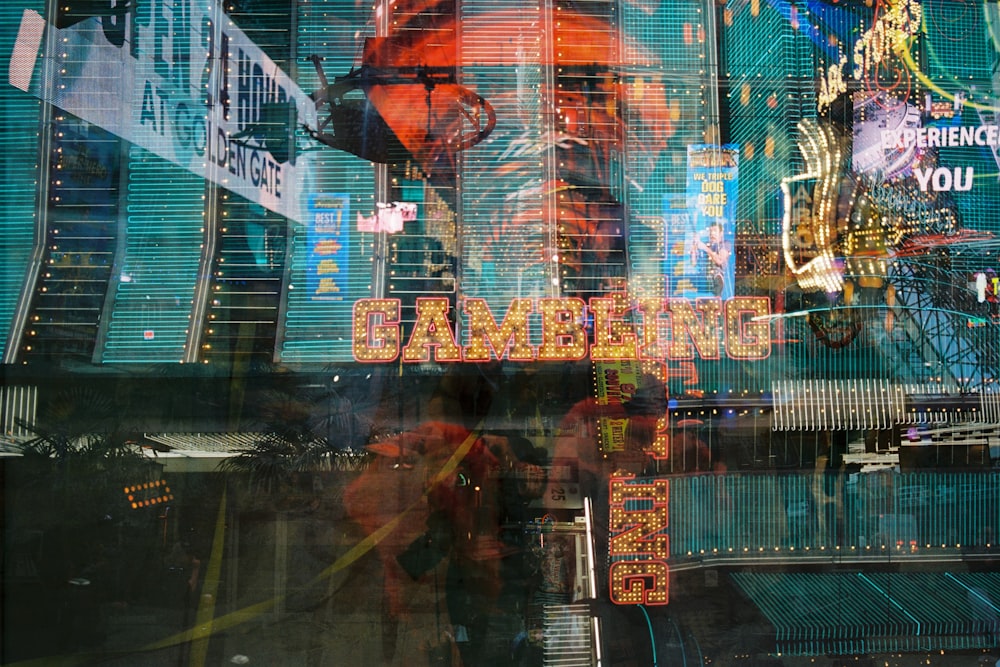 man in black jacket standing in front of glass window