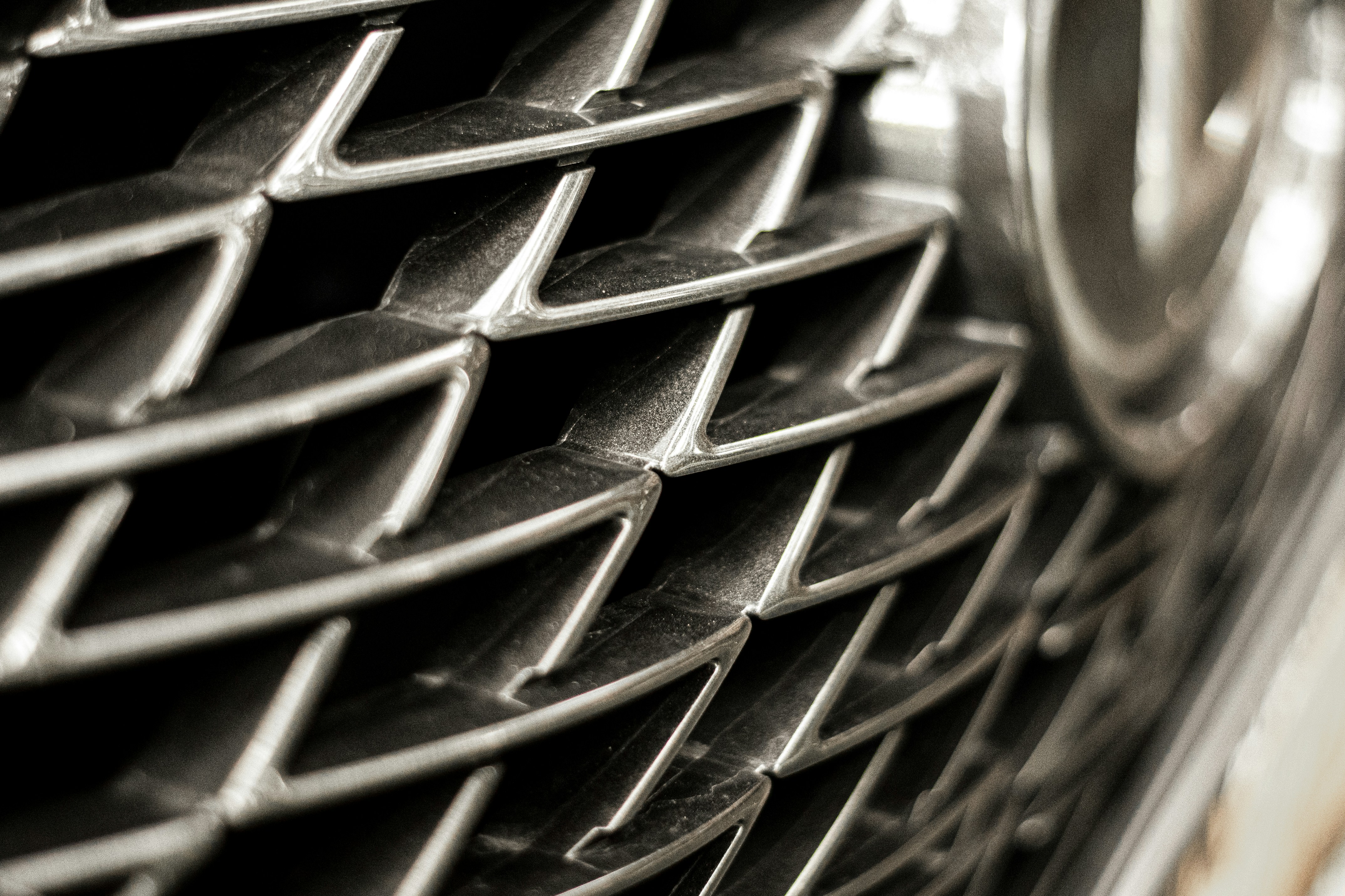 Close-up shot of Lexus NX's grill.