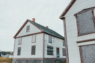 white and brown wooden house under white sky during daytime