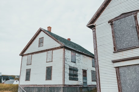 white and brown wooden house under white sky during daytime